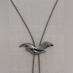 Avon 30 inch silver tone metal slide necklace bird pendant